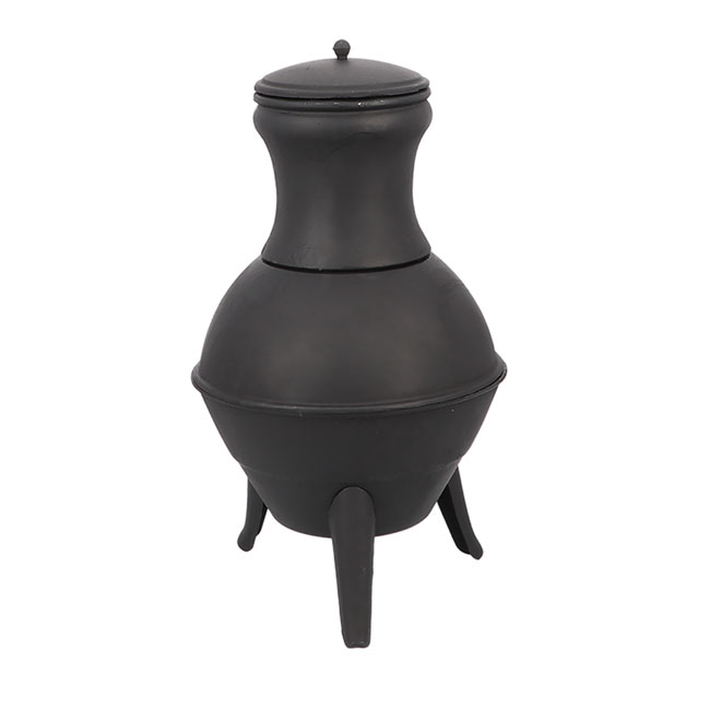 Black metal chiminea with a bulbous base and tall chimney, resting on three legs. It has a lid on top and exudes a rustic and sturdy appearance.