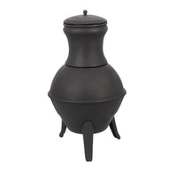 Black metal chiminea with a bulbous base and tall chimney, resting on three legs. It has a lid on top and exudes a rustic and sturdy appearance.