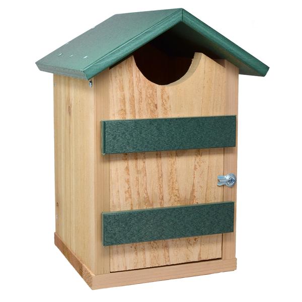 A wooden screech owl house with a natural wood body, a green roof, and two green horizontal panels on the front door, shown against a plain white background.