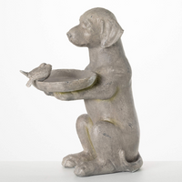 Side view of the Labrador Retriever Bird Feeder, showing the raised dog design holding a seed dish with a decorative bird.