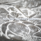 Close-up of Songbird Stepping Stone featuring intricate flower, leaf, and bird design in a gray cement finish, perfect for garden paths and outdoor decor