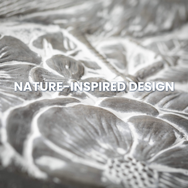 Close-up of Songbird Stepping Stone featuring intricate flower, leaf, and bird design in a gray cement finish, perfect for garden paths and outdoor decor