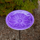 Stylish purple birdbath with a floral embossed design, crafted from steel with multiple layers of Eco-Friendly UV-resistant epoxy to ensure lasting beauty. Stands 39 inches tall with a sturdy bronze-finish wrought iron stake