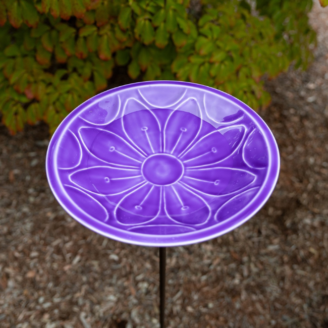 Stylish purple birdbath with a floral embossed design, crafted from steel with multiple layers of Eco-Friendly UV-resistant epoxy to ensure lasting beauty. Stands 39 inches tall with a sturdy bronze-finish wrought iron stake