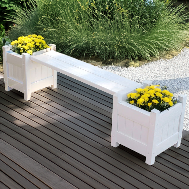 A white vinyl planter bench placed on a modern patio, filled with vibrant yellow flowers for a pop of color.