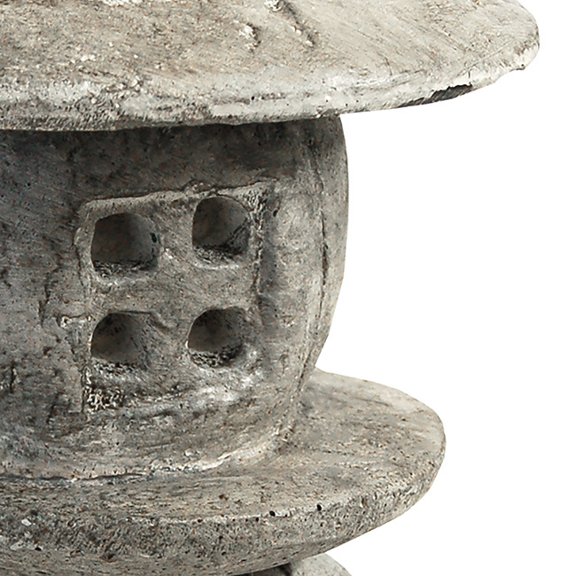 Zen Haven small round pagoda statues placed in a garden, enhancing the tranquility of the space with their serene presence.