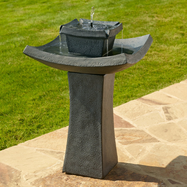 Zen Oasis Solar Fountain with smooth, curved lines and a sleek black and grey finish, adding a modern touch to outdoor gardens and patios