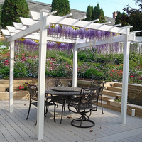The BreezeWay White Pergola showcasing purple wisteria climbing over the structure, adding a dynamic and enchanting element to your garden. Its durable white vinyl frame offers both beauty and functionality.